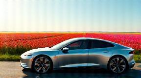 Luxury electric car parked by tulip fields